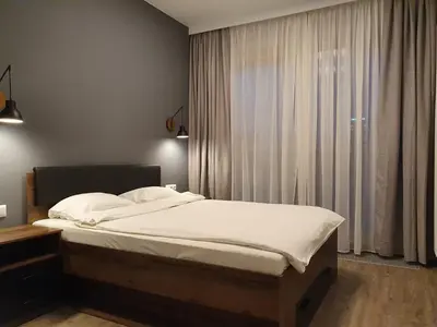 Łóżko lub łóżka w pokoju w obiekcie Chopin Apartments - City