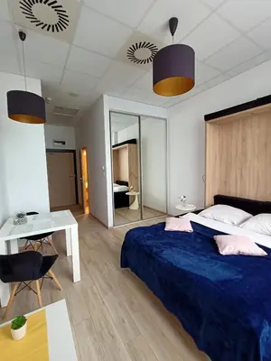 Łóżko lub łóżka w pokoju w obiekcie Zlatarooms