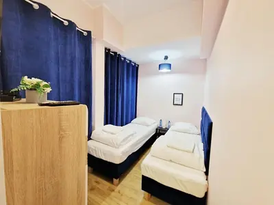 Łóżko lub łóżka w pokoju w obiekcie Apart HoStel Helvetia B&B