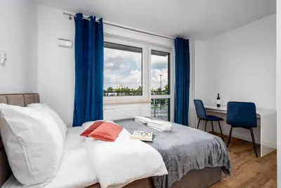 Łóżko lub łóżka w pokoju w obiekcie Warsaw Modern Stay