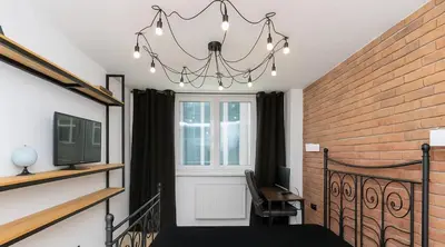 Telewizja i/lub zestaw kina domowego w obiekcie 133 Modern Warsaw Apartments