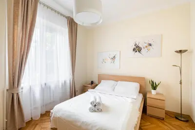 Łóżko lub łóżka w pokoju w obiekcie Apartament Plac Konstytucji