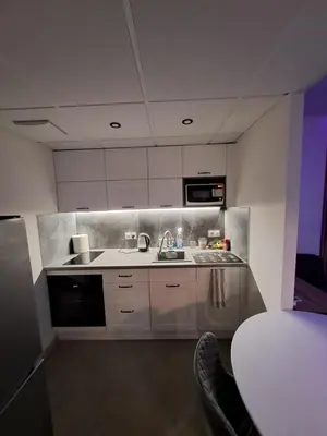 Kuchnia lub aneks kuchenny w obiekcie Warsaw Smart Apartment with Parking