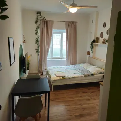 Łóżko lub łóżka w pokoju w obiekcie Smulik Flat 23