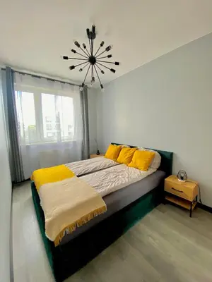 Łóżko lub łóżka w pokoju w obiekcie Modern & Cozy Apartment in Warsaw in Perfect Location