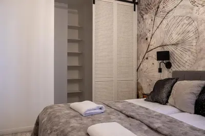 Łóżko lub łóżka w pokoju w obiekcie Stylish Apartment with Balcony and Garage Mokotów