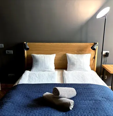 Łóżko lub łóżka w pokoju w obiekcie Loft apartamenty w centrum Warszawy lok 2
