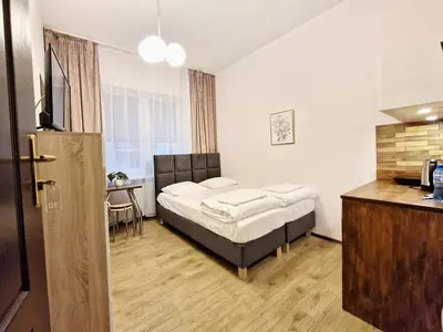 Łóżko lub łóżka w pokoju w obiekcie Hostel Helvetia - Private Rooms in City Center