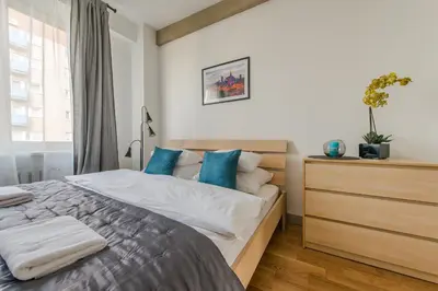 Łóżko lub łóżka w pokoju w obiekcie Dworzec Centralny P&O Serviced Apartments