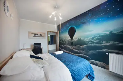 Łóżko lub łóżka w pokoju w obiekcie P&O Business Serviced Apartments CYBERNETYKI