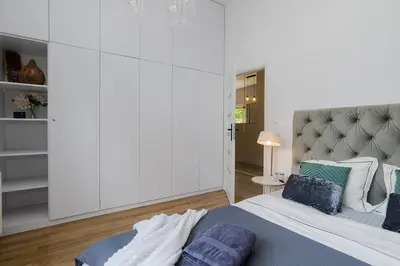 Łóżko lub łóżka w pokoju w obiekcie Woronicza Premium - Jungle Warsaw