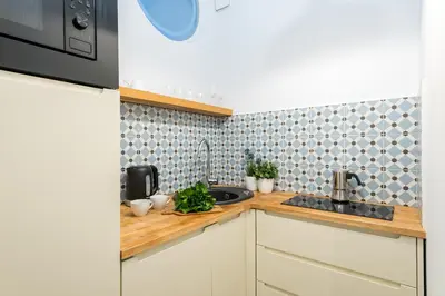 Kuchnia lub aneks kuchenny w obiekcie Poznanska Serviced Apartments