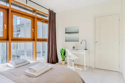 Łóżko lub łóżka w pokoju w obiekcie Zygmunta Slominskiego 5 - P&O Apartments