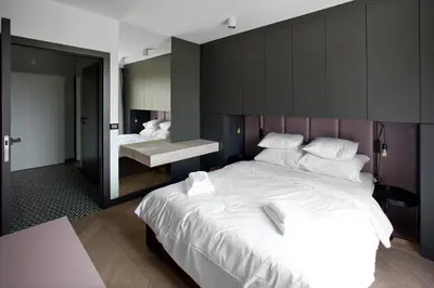 Łóżko lub łóżka w pokoju w obiekcie Praga Zupnicza P&O Serviced Apartments
