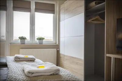 Łóżko lub łóżka w pokoju w obiekcie P&O Serviced Apartments NOWOGRODZKA