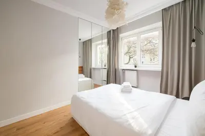 Łóżko lub łóżka w pokoju w obiekcie Stylish Cozy flat in Warsaw center