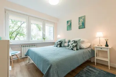 Łóżko lub łóżka w pokoju w obiekcie 3 bedroom apartment KASPRZAKA - P&O Serviced Apartments