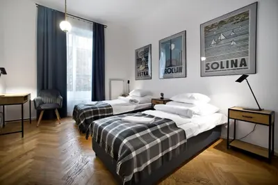 Łóżko lub łóżka w pokoju w obiekcie P&O Apartments Warecka Street