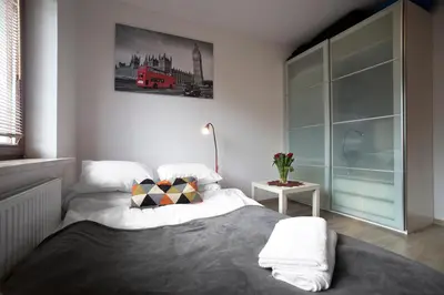 Łóżko lub łóżka w pokoju w obiekcie Airport Okecie Klobucka P&O Serviced Apartments