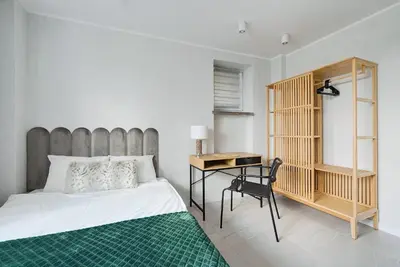 Łóżko lub łóżka w pokoju w obiekcie Plater Residence Apartments