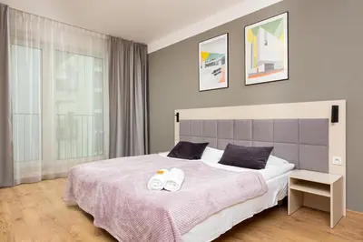 Łóżko lub łóżka w pokoju w obiekcie Business Studio Apartments Wolska by Noclegi Renters