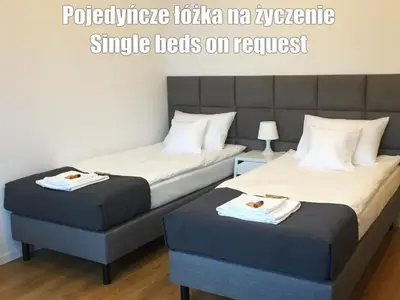 Łóżko lub łóżka w pokoju w obiekcie Vista Residence Premium II- Free Underground Parking - City Center - Self Check-in