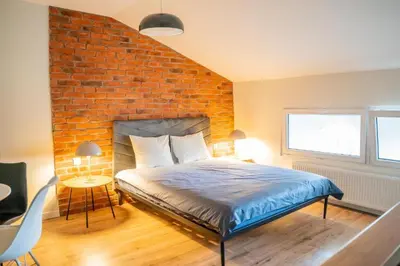 Łóżko lub łóżka w pokoju w obiekcie Moon Apartments Warszawa