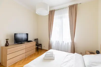 Łóżko lub łóżka w pokoju w obiekcie P&O Serviced Apartments Plac Konstytucji