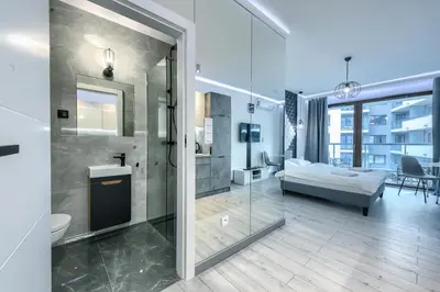 Łóżko lub łóżka w pokoju w obiekcie Mayad Residence